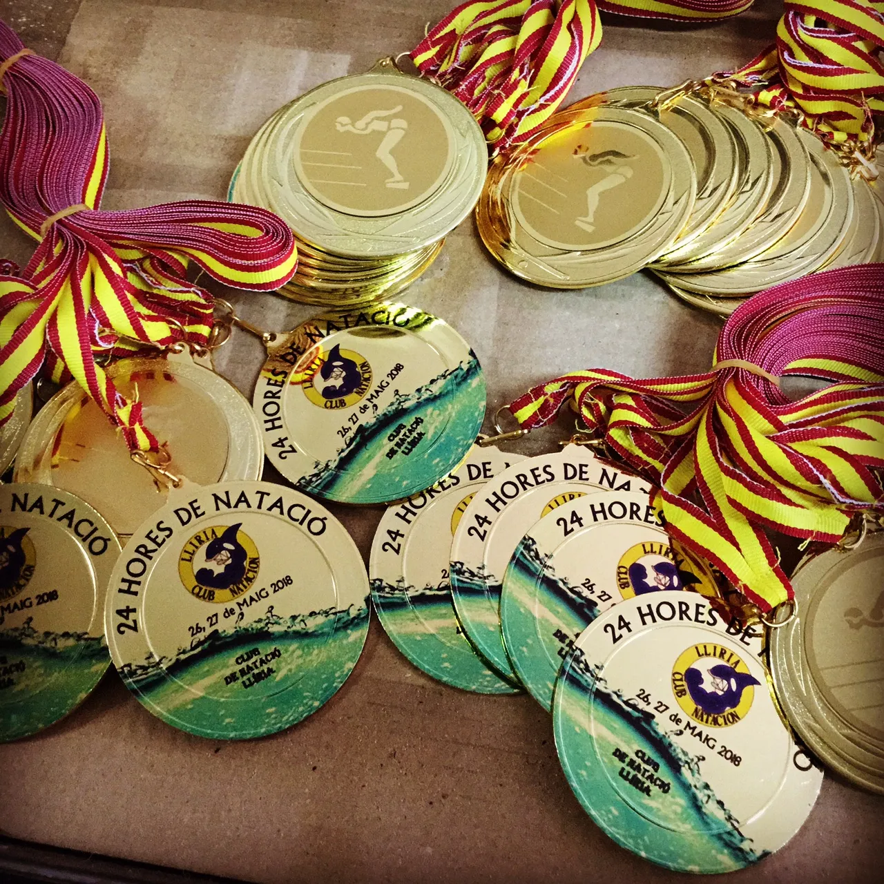 medallas series natación